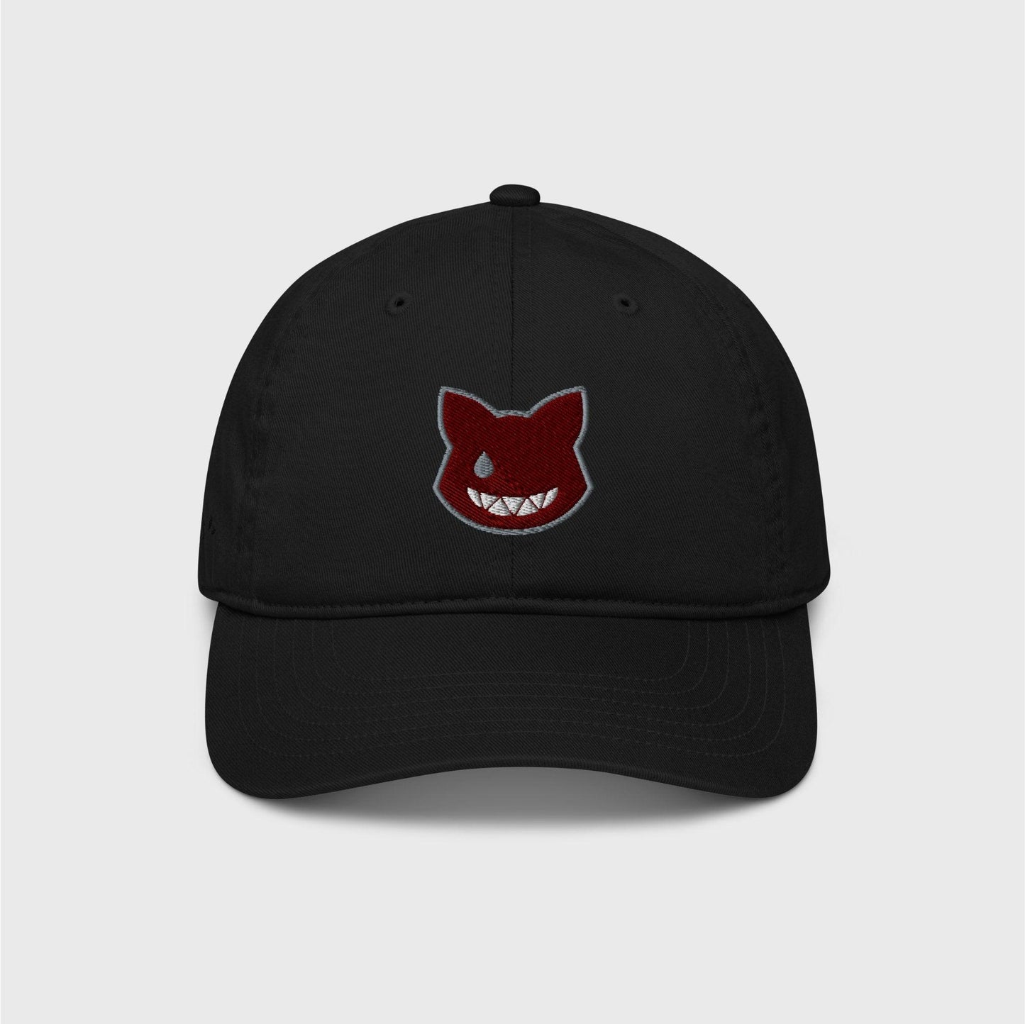 A classic black cap featuring an embroidered wine red logo shaped as a cat’s head, lined in grey, showing only a left grey eye the shape of a water drop and a fanged white smile.