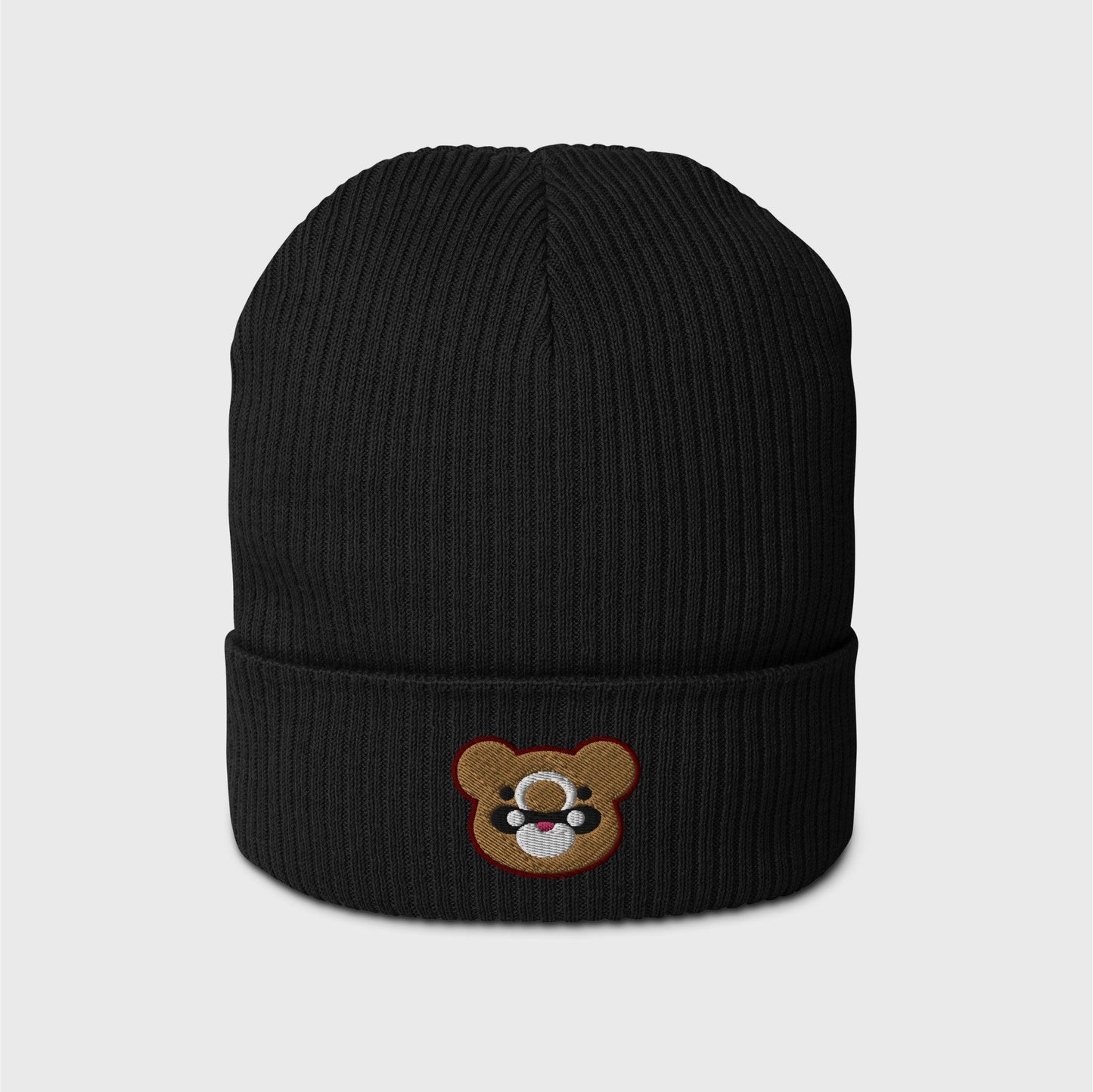 A black ribbed beanie featuring an embroidered bear head shape of Gouda in gold, with black and white marks and lined in dark red.