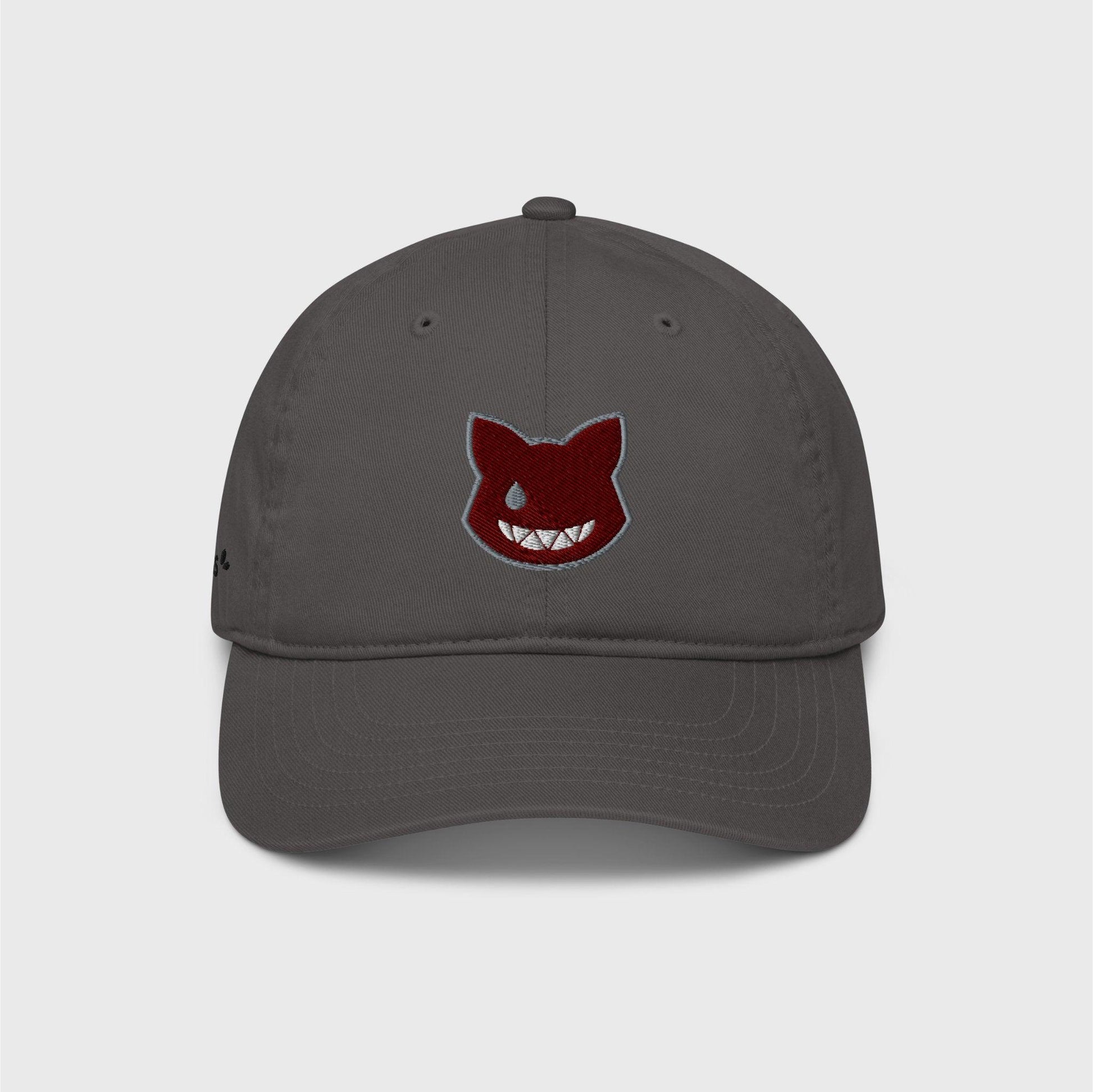 A classic grey cap featuring an embroidered wine red logo shaped as a cat’s head, lined in grey, showing only a left grey eye the shape of a water drop and a fanged white smile.