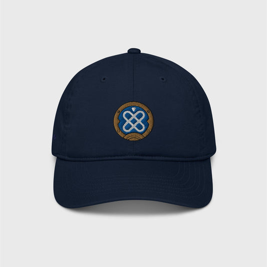 A classic navy blue cap featuring an embroidered round logo of Freminet's diving helmet, in blue with a white round shapes crossed in the centre and a round gold border around it.