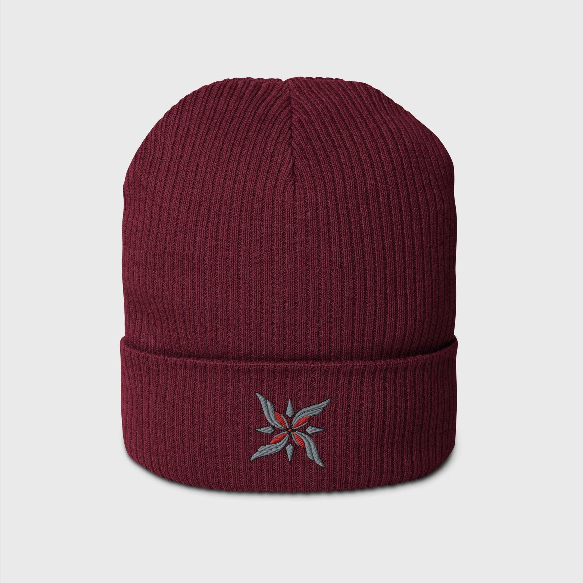 A wine red ribbed beanie featuring an embroidered logo of Arlecchino's Sigil - four winged grey shapes make a cross with a red jewel imbued on each, lined in black