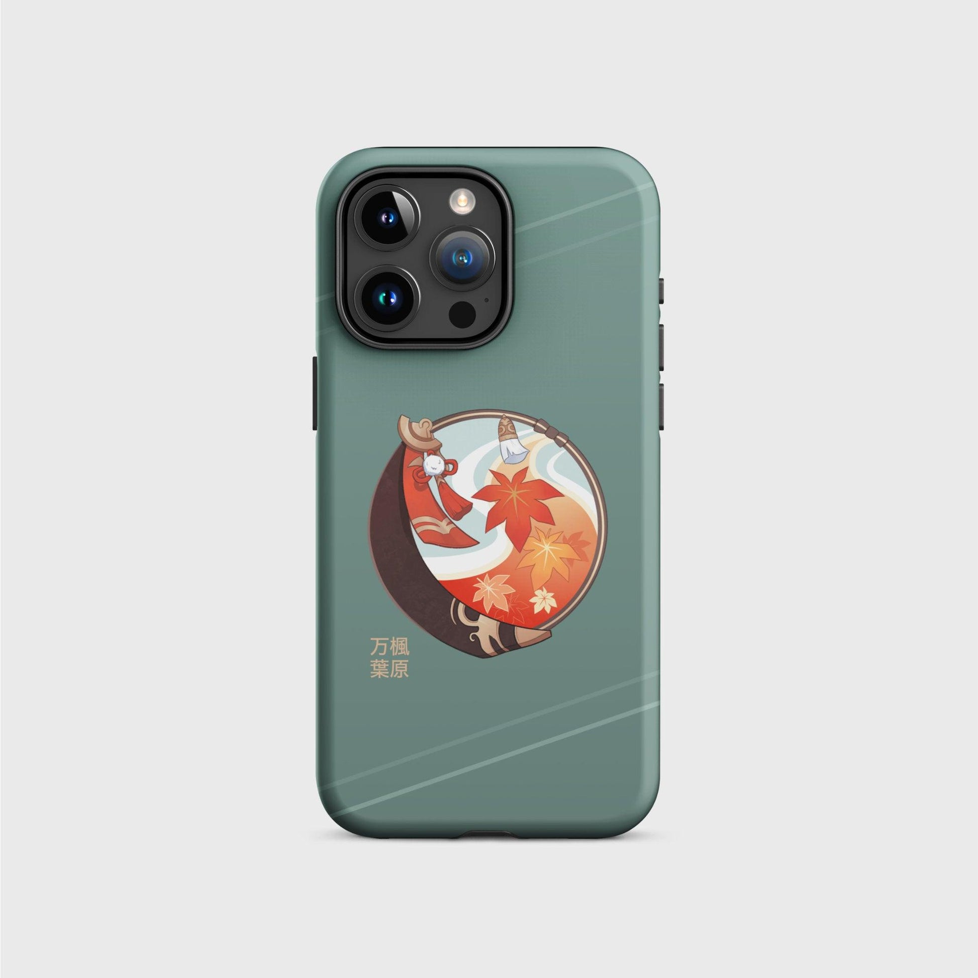 A green iPhone case featuring a round design with Kazuha's abilities and outfit elements such as his brown scarf and orange and yellow maple leaves on a soft air current background. His name is in gold Japanese characters on the bottom left of the design.