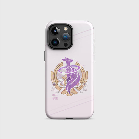 An iPhone tough case with a soft pink gradient going from darker on the top to brighter on the bottom, featuring a purple electro fox surrounded by a golden half moon element from Yae’s outfit. Behind the fox, sakura blossom petals fall on the background. Her name shows in gold Japanese characters at the bottom left of the design. Soft pink lines cross the top and bottom of the case diagonally.