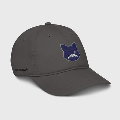 A side view of the grey cap showing the embroidered logo at the front and black letters on the right side of the cap at the bottom saying "Mini Tigress”