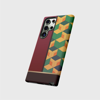 A tough Samsung case featuring Tomioka’s kimono pattern: the left side of the case is filled with a dark red, while the right side of the case is filled with a cubic pattern in greens, orange and yellow. A gold division 3/4 vertically from the bottom separates the pattern from a brown base.