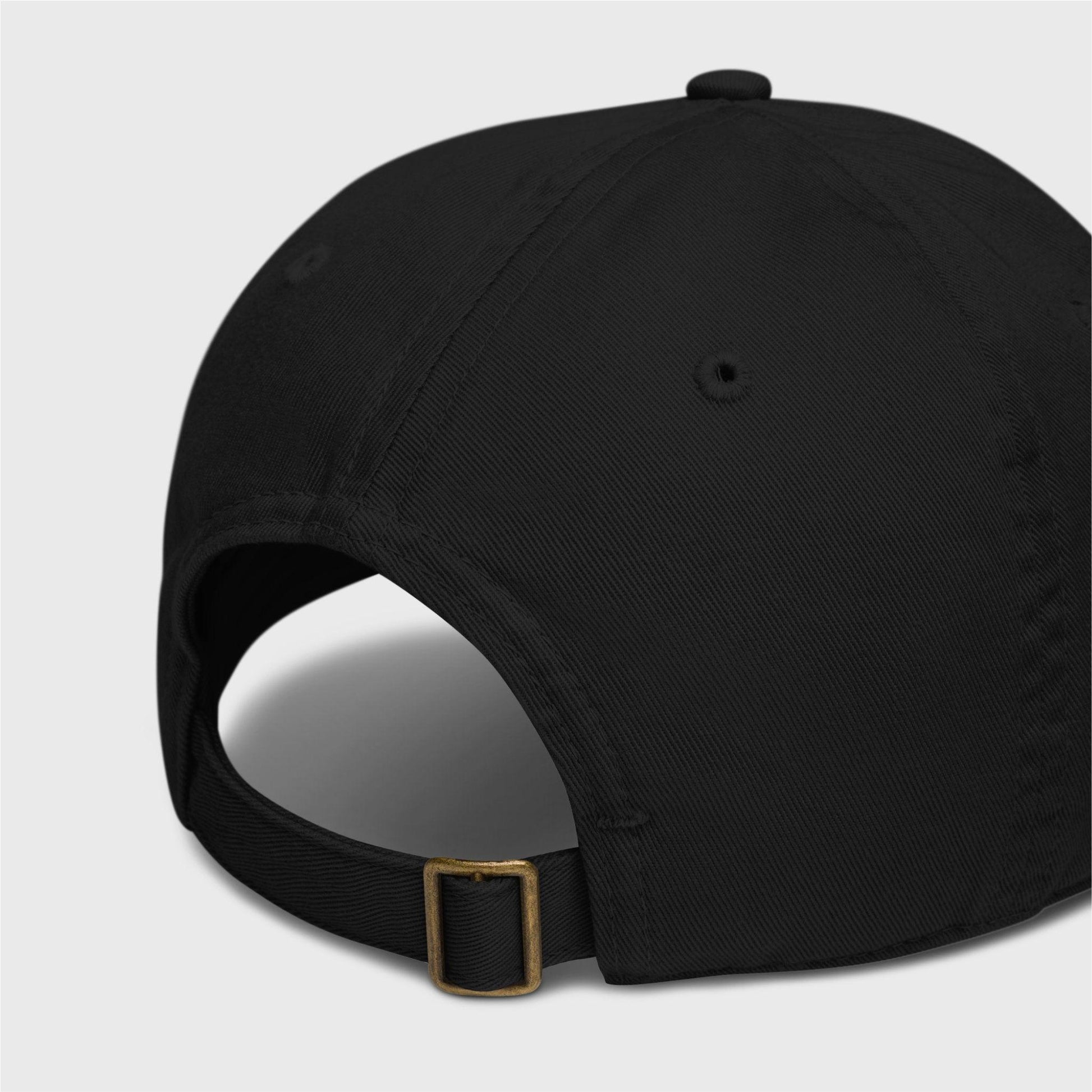 A close-up of the back of the cap showing a adjustable closure with a brass slider and hidden tuck-in.