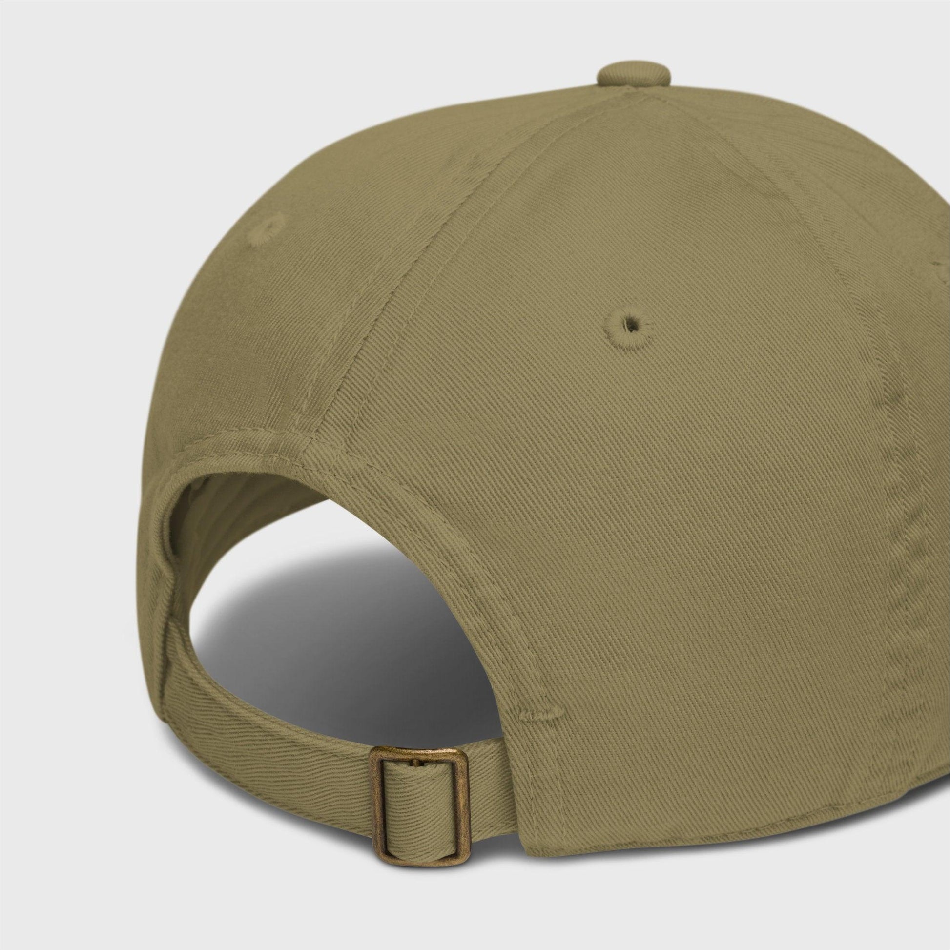 A close-up of the back of the cap showing a adjustable closure with a brass slider and hidden tuck-in.